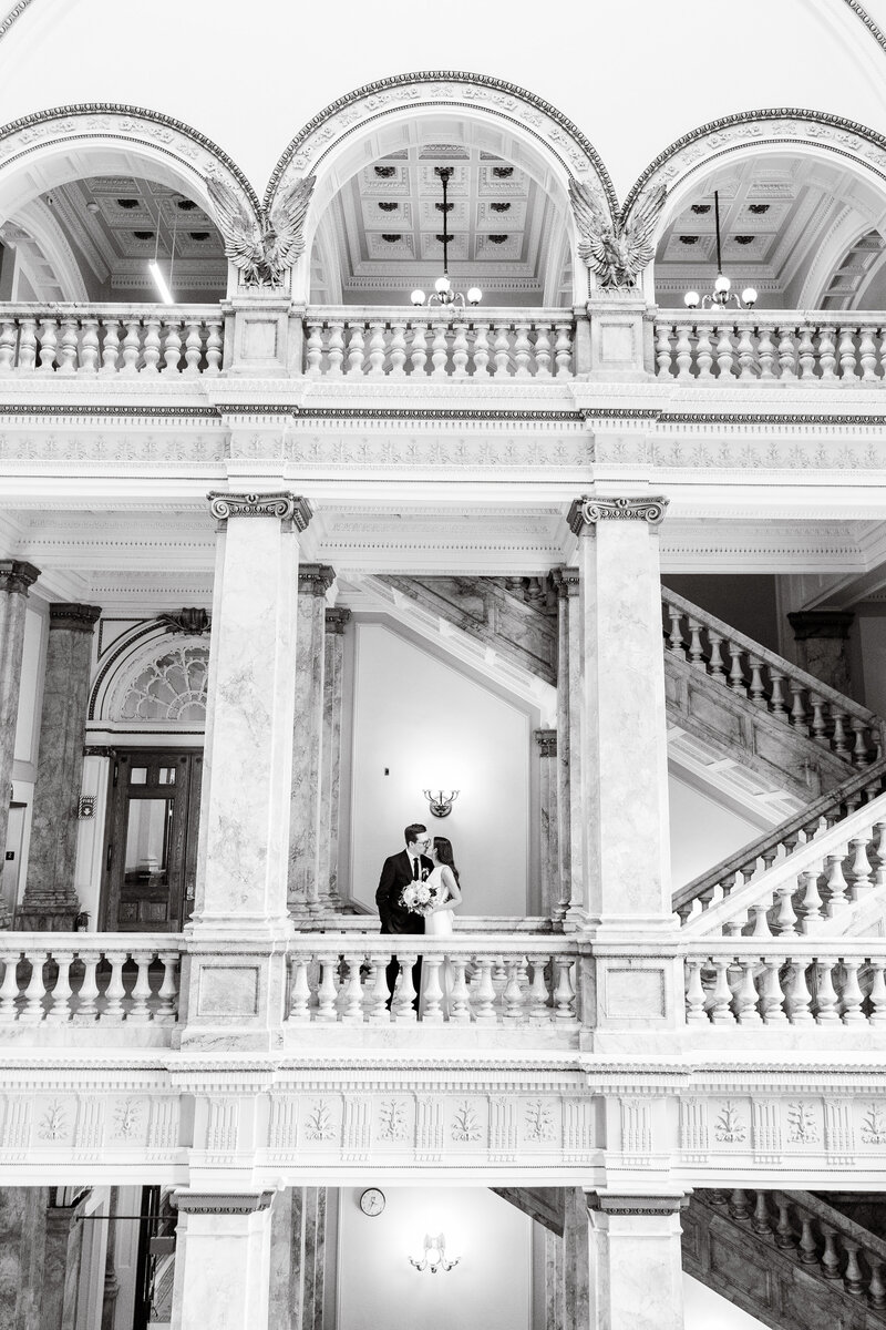 St. James 1868 Milwaukee Wedding. Couple posed at the Milwaukee Public Library.