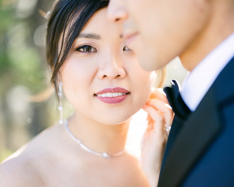 An elegant bridal portrait session at Baker Creek Mountain Resort, capturing the bride looking into the camera amidst the serene mountain setting.