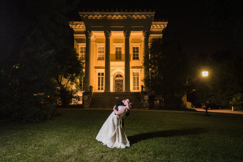 Couple dipping in front of the Evergreen Museum and Library