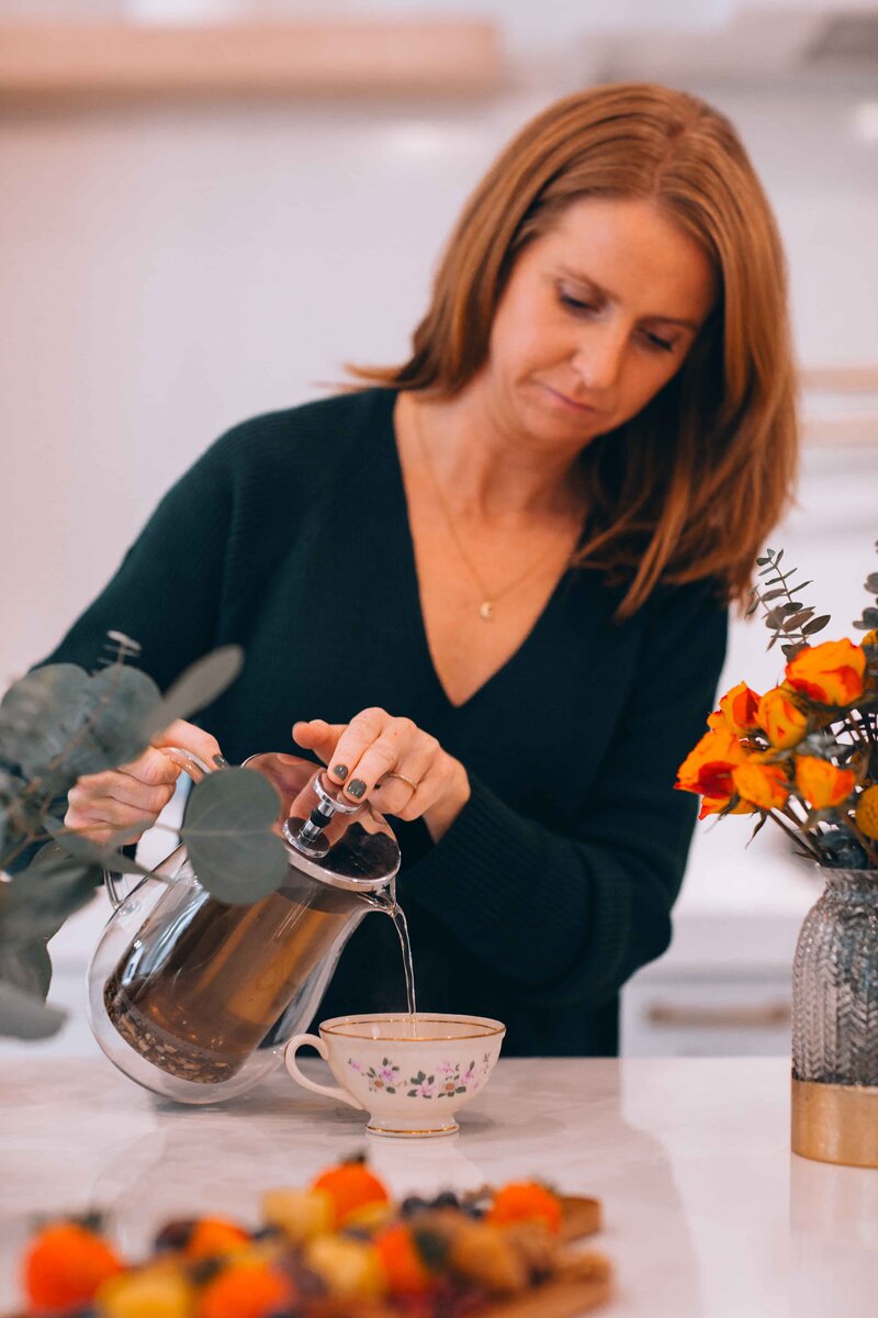 pouring herbal tea