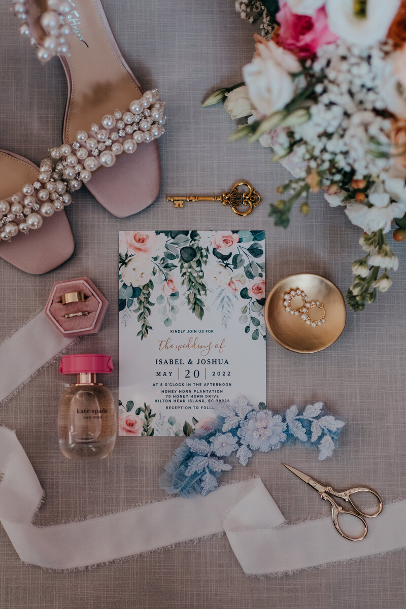 wedding flatlay of wedding invitations and details for hilton head wedding