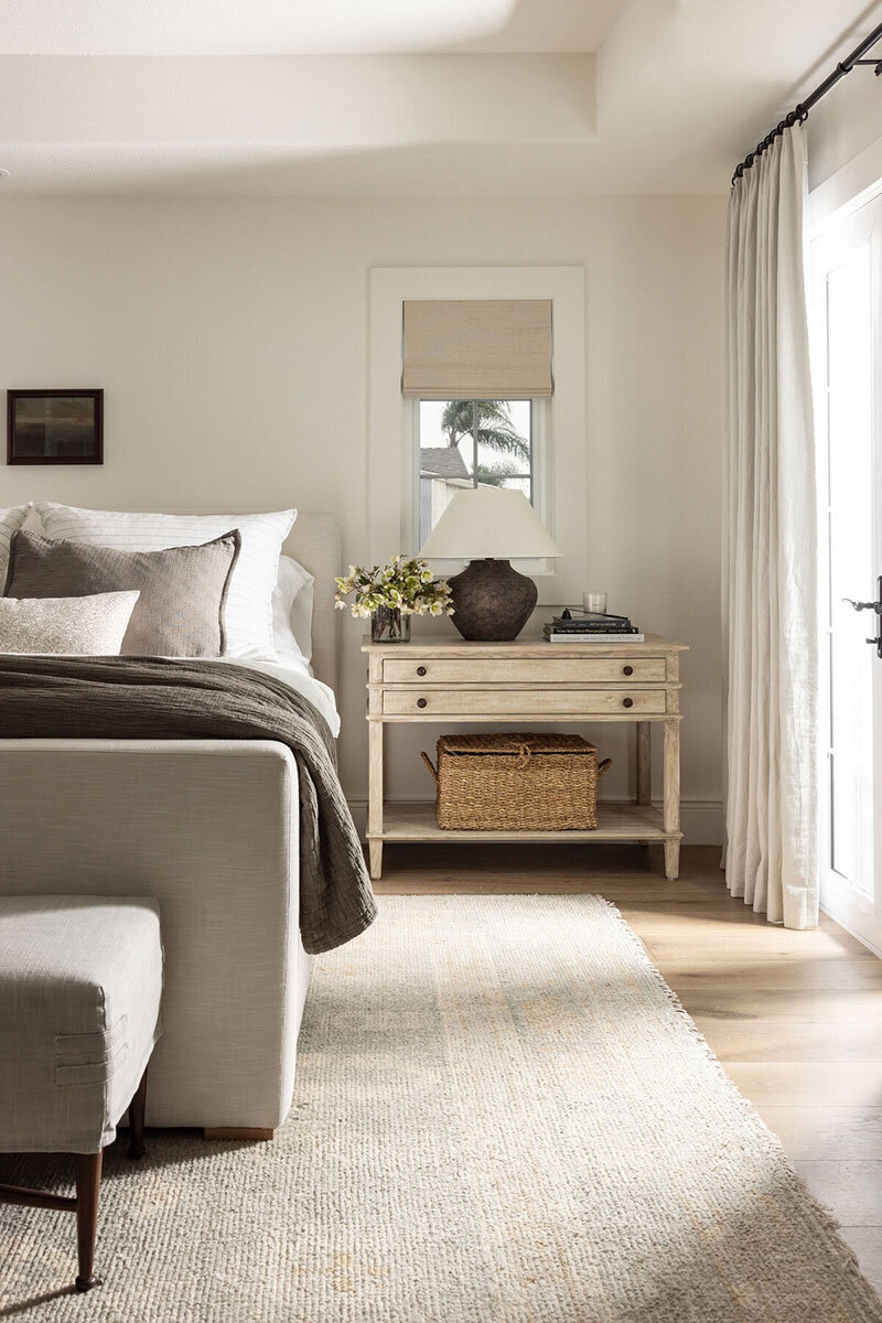 Bedroom featuring neutral palette and elevated European cottage charm
