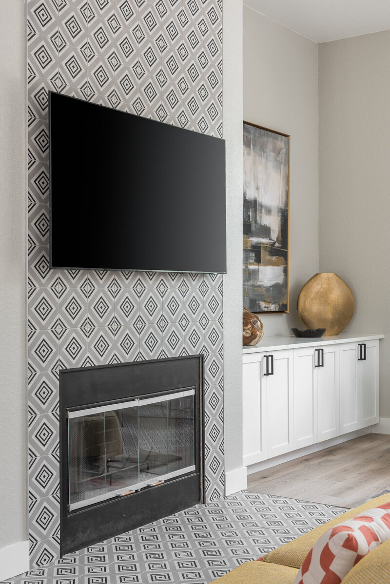 TV over fireplace with tiled fireplace surround