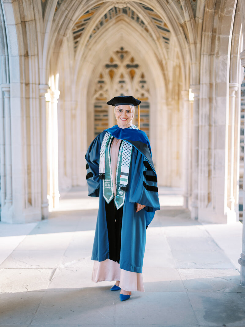 A Duke student posing for a photo near Duke Chapel
