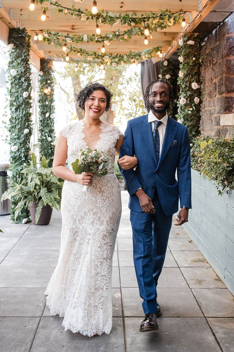 Columbian-bride-and-african-american-groom-hand-in-hand