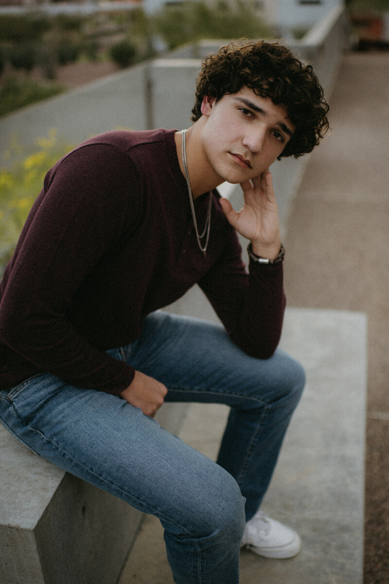 senior sitting on a bench giving a serious look in Scottsdale