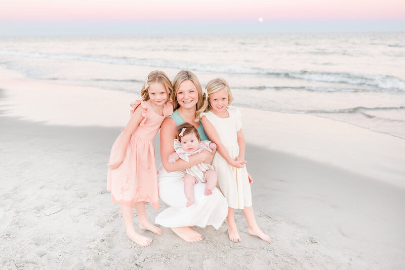 Myrtle Beach Family Photography of mom and daughters posing on the beach