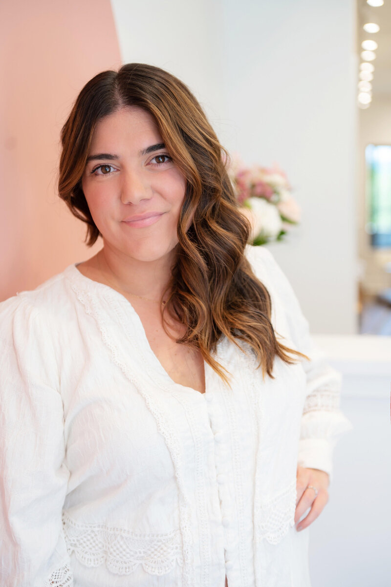 Liz Colasurdo, owner of Artisan Salon , cutting hair for a client