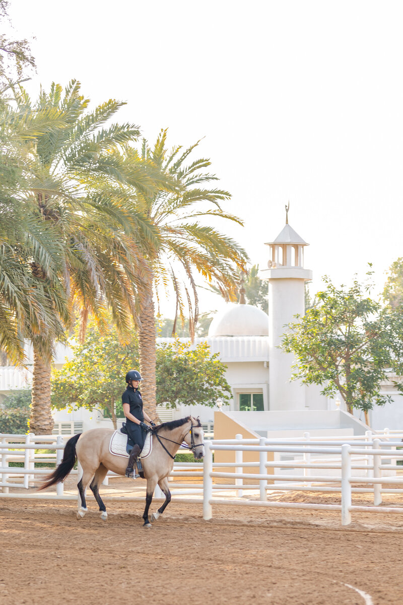 Woman and tan horse