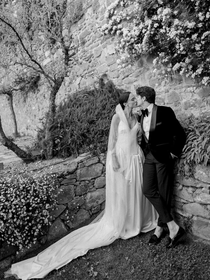 Bride in Monique Lhuillier walks with her father down the aisle at her wedding in Ravello at Villa la Rondinaia