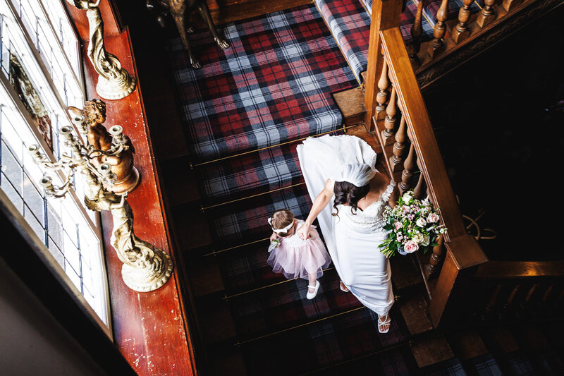 kent-wedding-photographer-bride-walking-down-stairs