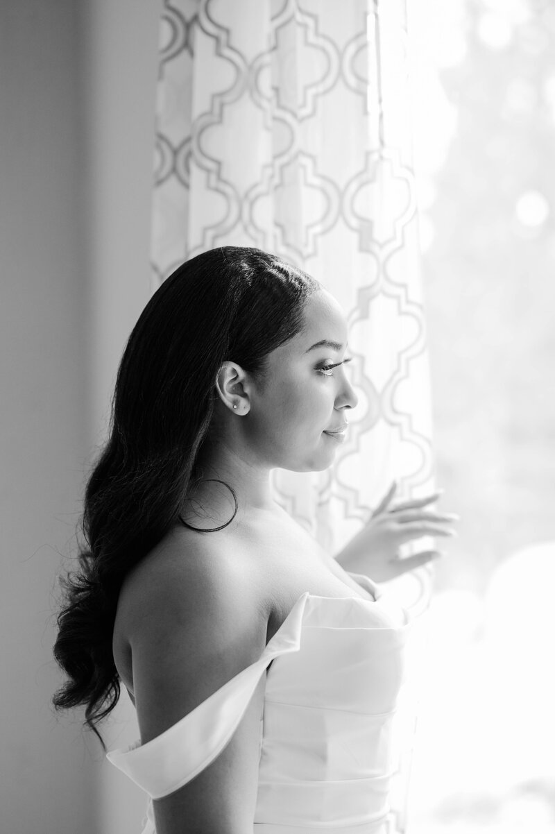 A bride looking out the window at Tannenbaum in Tahoe