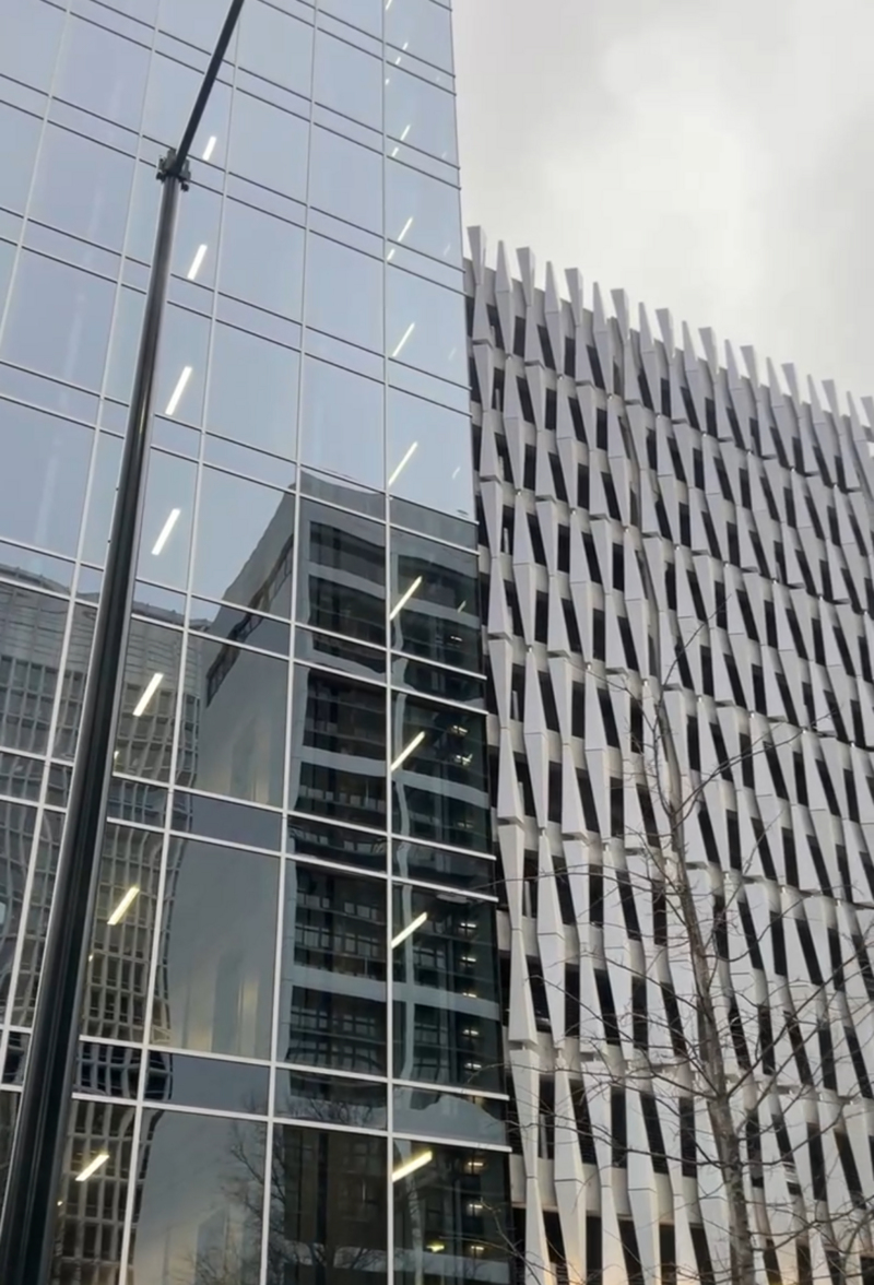 City Buildings with large glass windows and geometric designs.