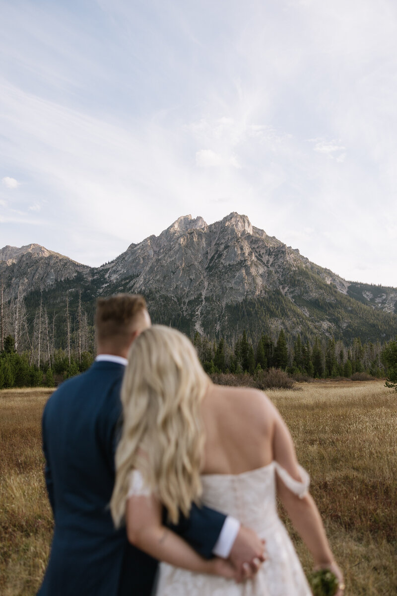 Bride and groom sharing a quiet moment at Stanley Lake during a destination wedding in Idaho