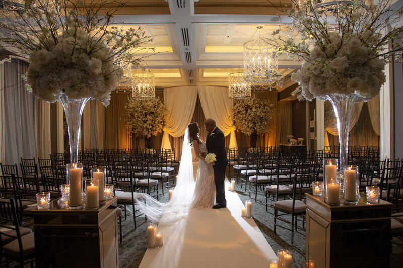 Bride and groom about to kiss at their wedding ceremony area