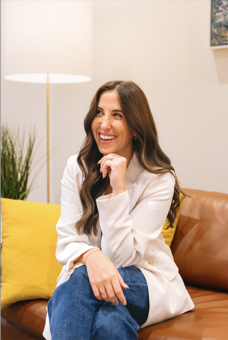 Raleigh EMDR Therapist sitting on the couch talking