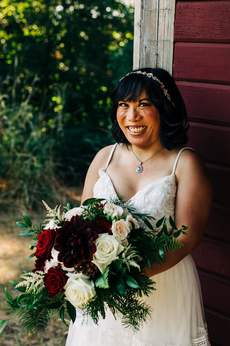 Bride with flowers on her Washington Mountain Elopement Day
