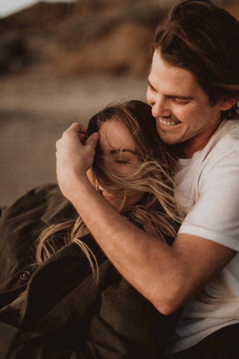 couple laughing in the wind