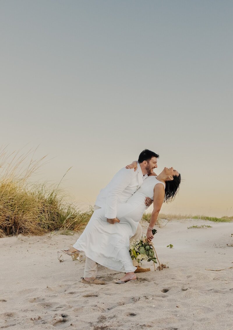 cristina pelino's portfolio image of a couple dancing on the beach in south florida