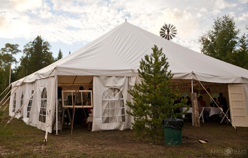 White tent set up on a rainy fall wedding day at Snow Mountain Ranch in Grand County