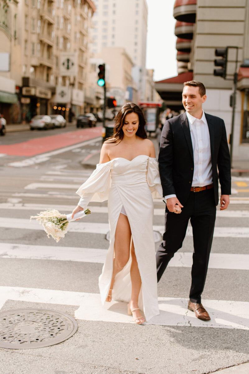 couple holding hands during wedding photos in san francisco
