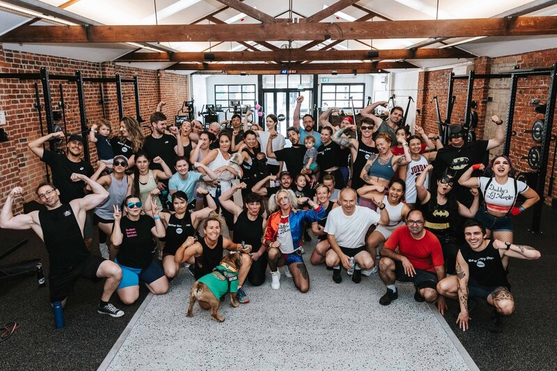 Gym members engaging in a community event, fostering camaraderie