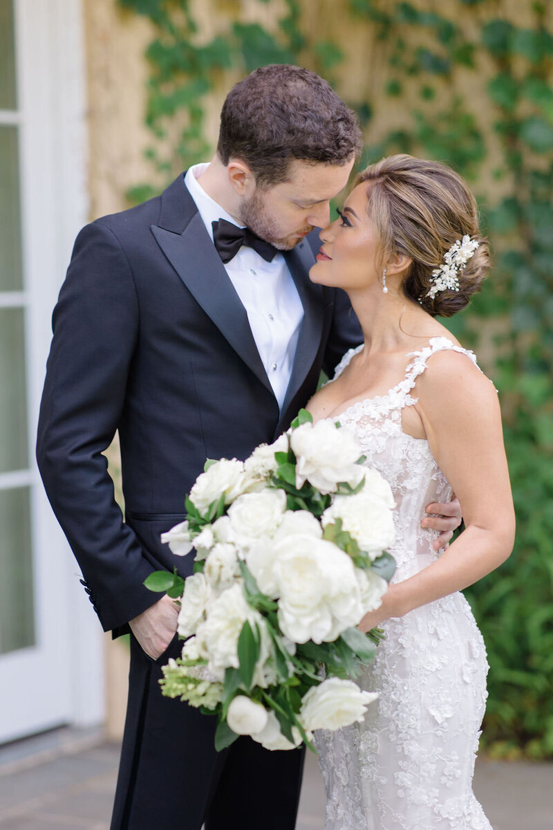 Husband and Wife hold each other and look into each others eyes