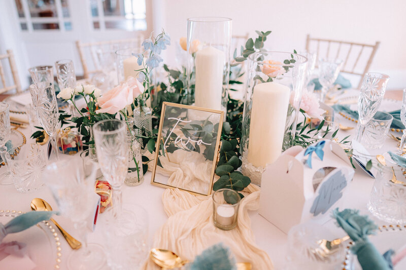 Carbis Bay wedding, white and lilac flowers cascading over the tables with silver candelabras. Flowers include alliums and orchids