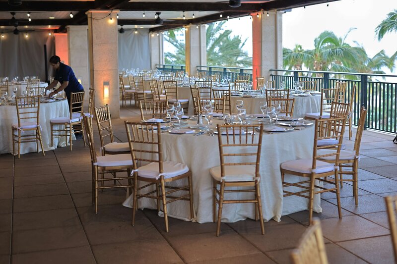 dinner tables for corporate event meeting with chiavarri gold chairs and elegant dinner layout