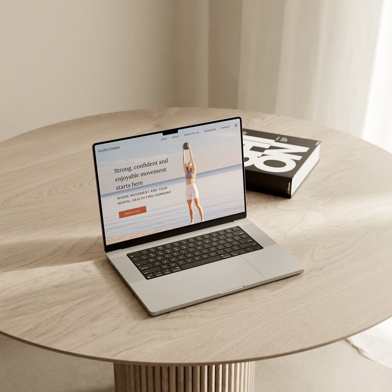 Custom Showit website design mockup on a laptop for a yoga and Pilates instructor, highlighting responsive and user-friendly web design for wellness entrepreneurs and fitness coaches