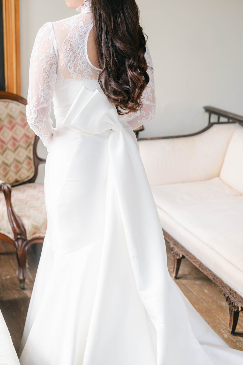 Bride in wedding dress with a bow on the back in Tuscaloosa, Alabama