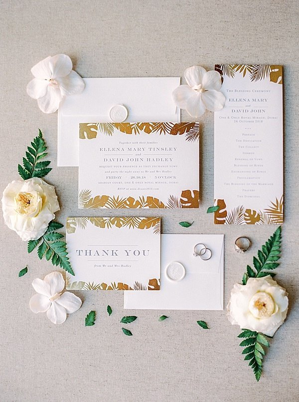 Gold and white invitation suite dubai wedding