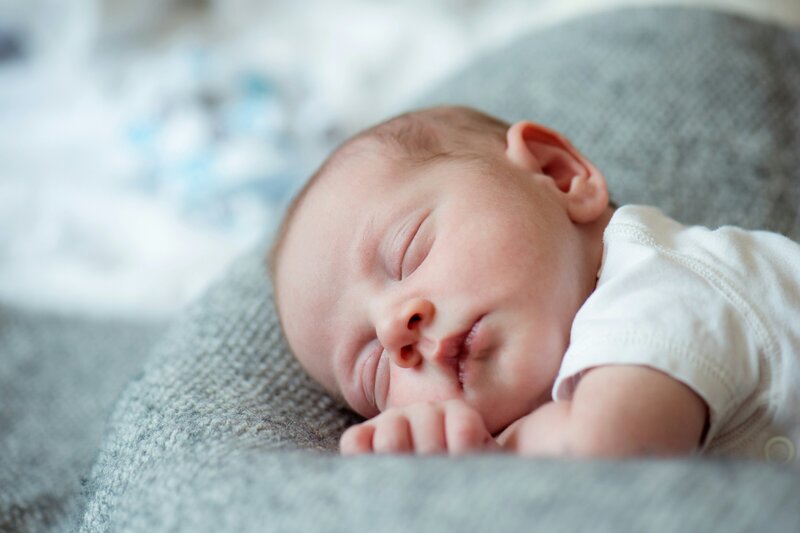 A newborn baby sleeping peacefully.