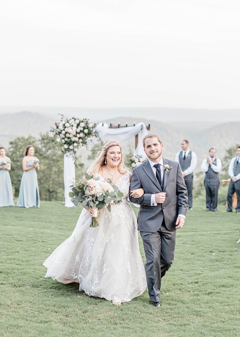 Bride and groom walk up memorial steps at their DC wedding