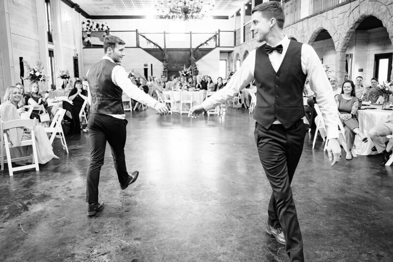 Two grooms doing their first dance