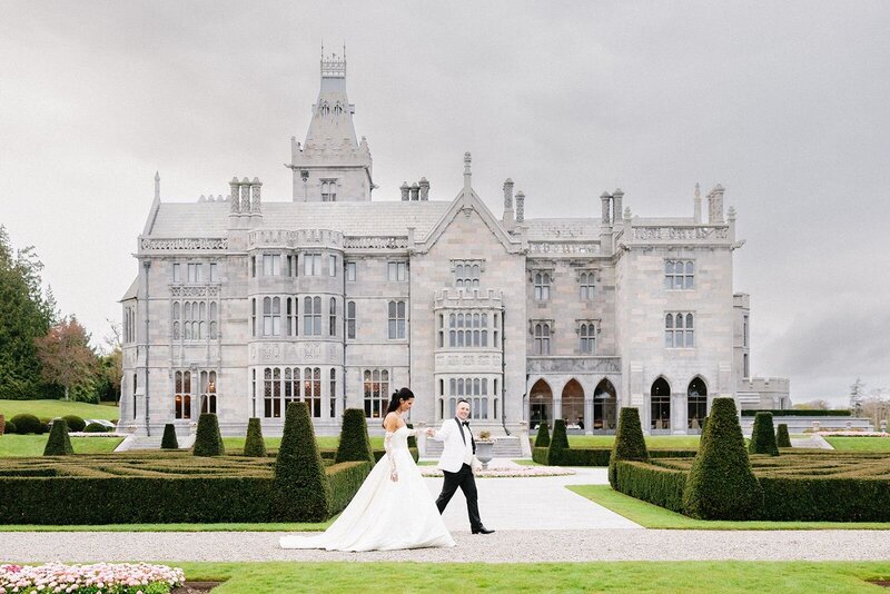 bride in wedding gown walking on ground of The Crane Estate
