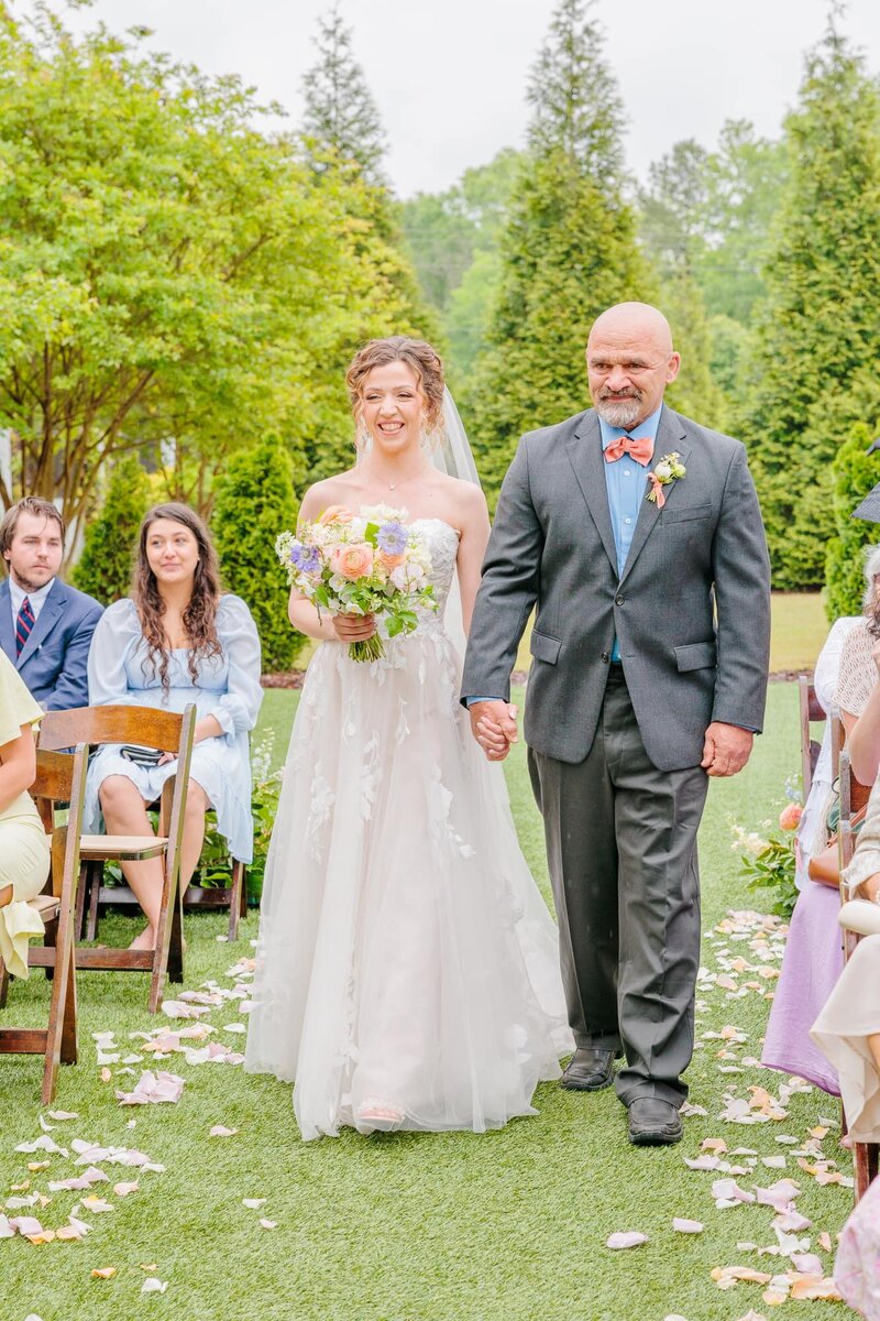 At this Bradford wedding, the father walks his daughter down the aisle.