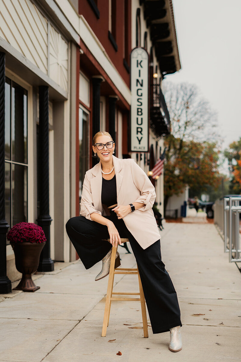 Owner of South Bend wedding hair and makeup company smiling while working