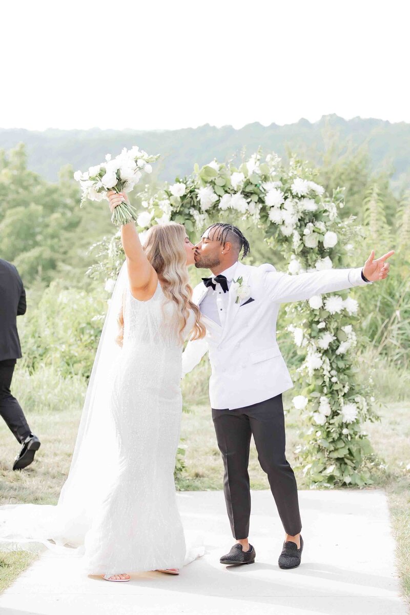 Bride and Groom celebrating their wedding day walking through confetti