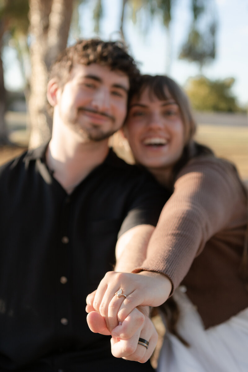 Jovanna G Photography. Classic, sophisticated Wedding Photos. Soft romantic engagement photos. Soft romantic WeddingPhotos. Sophisticated Wedding Photographer. Professional Wedding Photographer. Destination Wedding Photographer. Luxury Wedding photographer. Traveling Wedding Photographer. AZ Wedding Photographer. Gilbert AZ Wedding Photographer. Queen Creek Wedding Photographer. Phoenix Wedding Photographer. Scottsdale Wedding Photographer. Flagstaff Wedding Photographer. SoCal Wedding Photographer. California Wedding Photographer. Northern California Wedding Photographer. Southern California Wedding Photographer. San Francisco Wedding Photographer. Bay Area Wedding Photographer. San Jose Wedding Photographer. Golden Gate Bridge Wedding Photographer. Beach Lover Wedding Photographer. Palace of the Fine Arts Wedding Photographer. Ocean Lover. I love California. Orange County Wedding Photographer. Newport Beach Couples Photographer. Newport Beach Wedding Photographer. Laguna Beach Couples Beach Engagement Photographer. Laguna Beach wedding beach photographer. Los Angeles Wedding Photographer. Young and in love engaged couples who live in southern California. Christian Young Couple. Young Engaged Couple. Engaged High School Christian Couple. Christian Values. Young conservative Christian women. Young Conservative Christian men. Young Conservative Christian Couple. Young Christian Couple Engaged in High School. Young Christian College Couple. Lakeside Lovers in the Autumn Sun. David & Grace - engagement photos. Jovanna G Photographer Engagement Photos. Arizona sun shining through autumn trees- engagement. Chandler, AZ Engagement Photos. Chandler, AZ 2026 bride. Chandler, AZ Wedding Photographer. Chandler, AZ Young Engaged Couple. Girl in her 20s. Engaged Arizona Girl in her 20s. Lakeside Engagement photos. AZ Lakeside Engagement Photos. AZ Weeping Willow Lakeside Proposal. Arizona Lakeside Proposal with weeping willow tree. Detail shot of engagement ring on Arizona Lakeside estate. Chandler, AZ Lakeside Estate Proposal Outfit Inspiration.