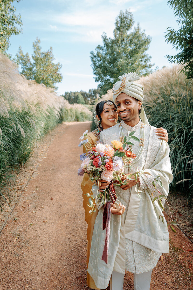 Rolling Canva Bride and Groom holding bridal bouquet
