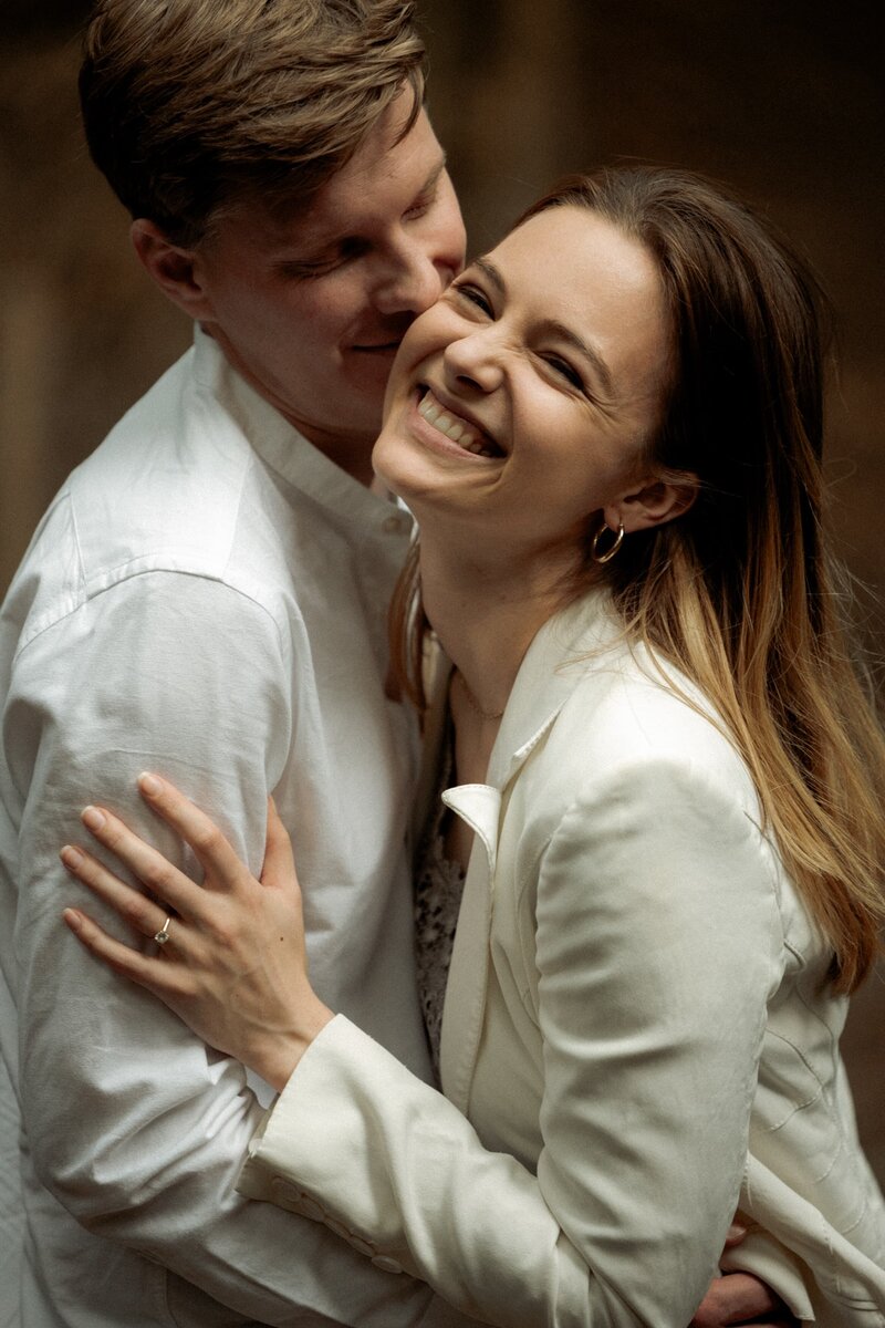 Cute couple posing for London elopement photographer
