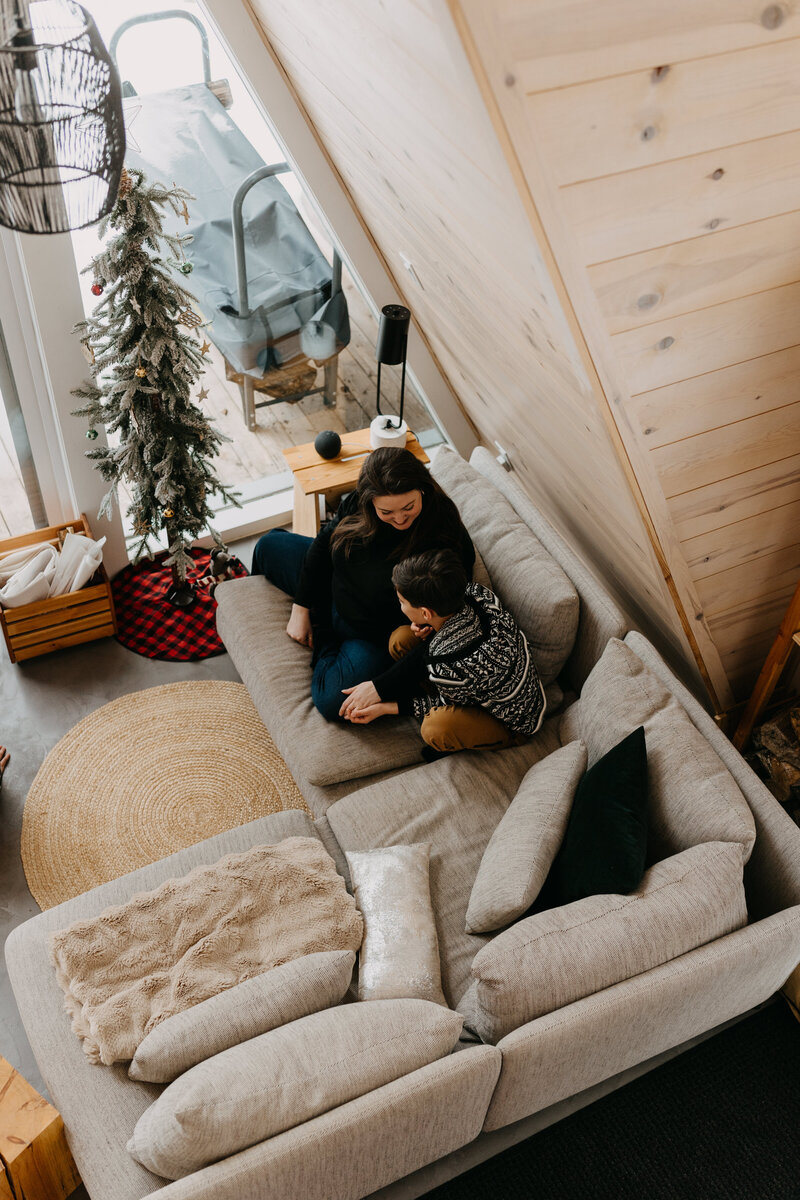 An overhead view of a mother and child having fun at Chalets Prunella No. 1 accomodation in Quebec.
