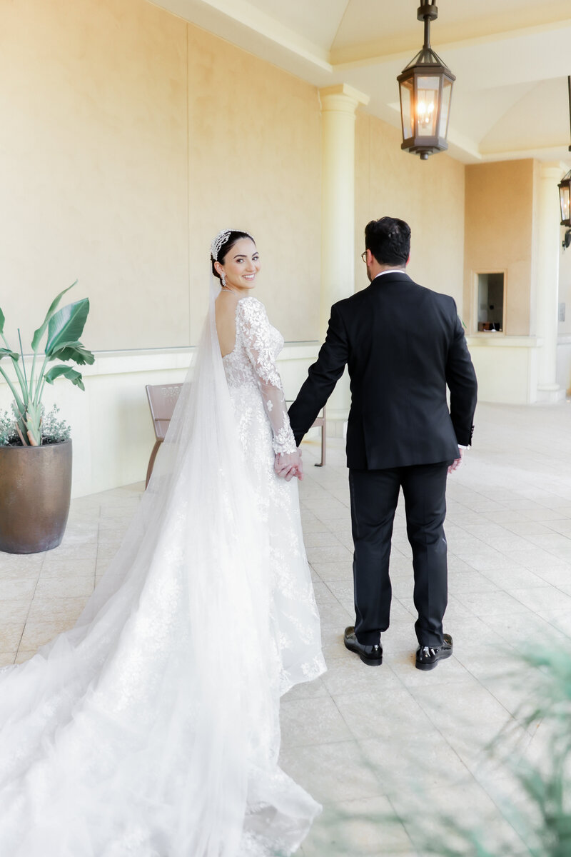 Bride and groom portrait at a wedding at the four seasons Orlando by Florida wedding photographer.