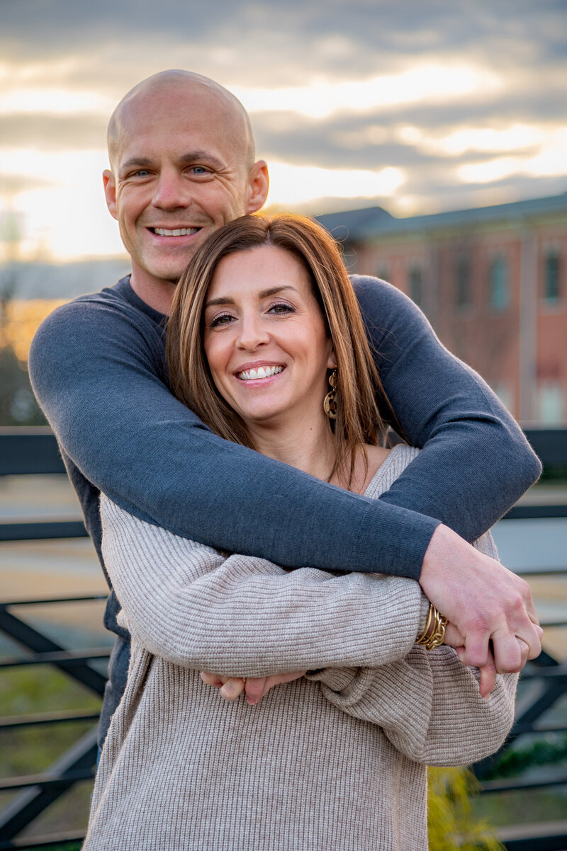 Loving couple smiling in Cambridge Square Park - Perfect for a big city feel in a small town setting - Ooltewah, TN