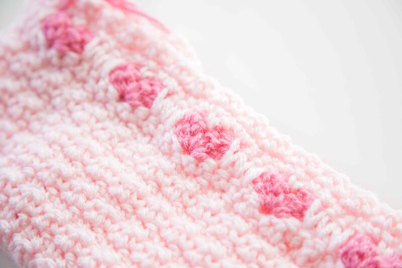 pink knitted cradle for stillborn baby girl in heaven