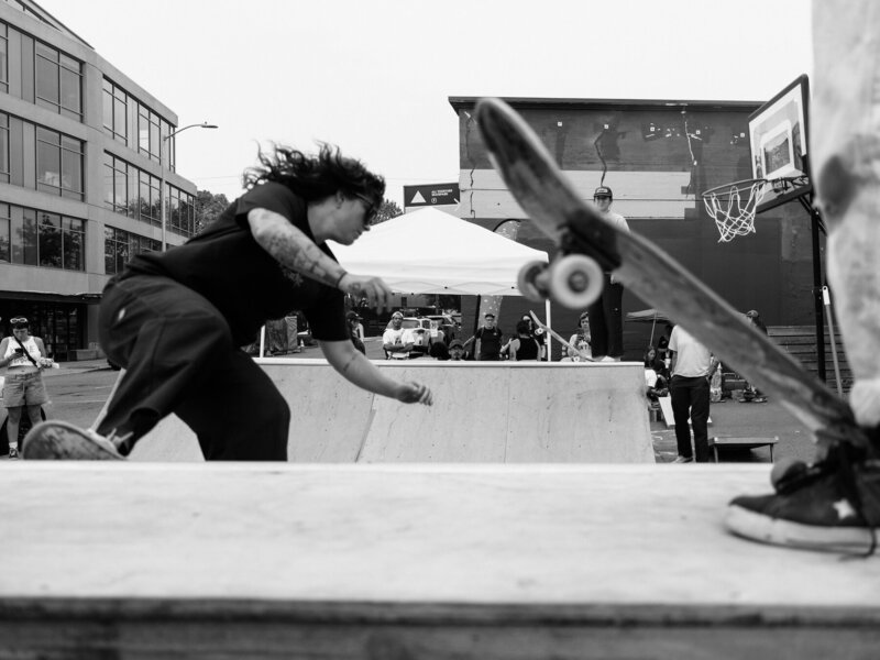 Action shot of pro woman skater doing tricks