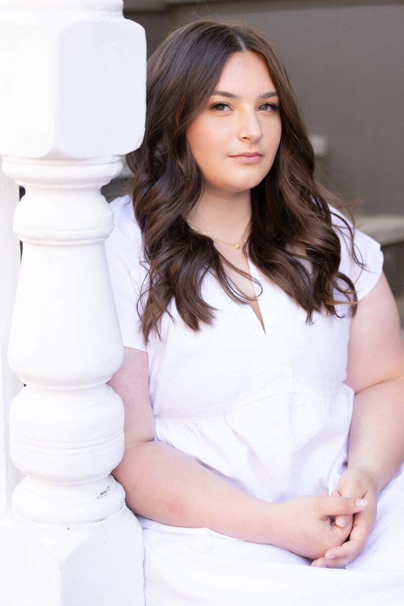 High School Senior in Downtown Annapolis sits on stairs