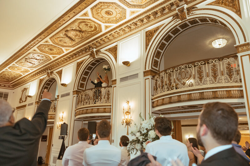 couple makes their grand entrance from the second floor of the colony club! one of the best venues in detroit