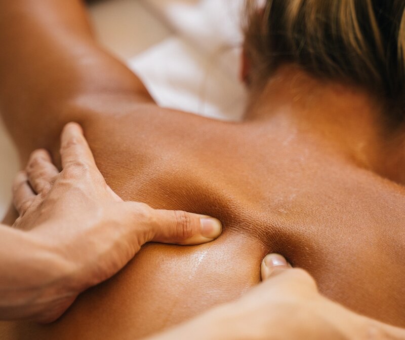 Close-up massage treatment for Pure Serenity Massage and Beauty, showing expert hands at work.